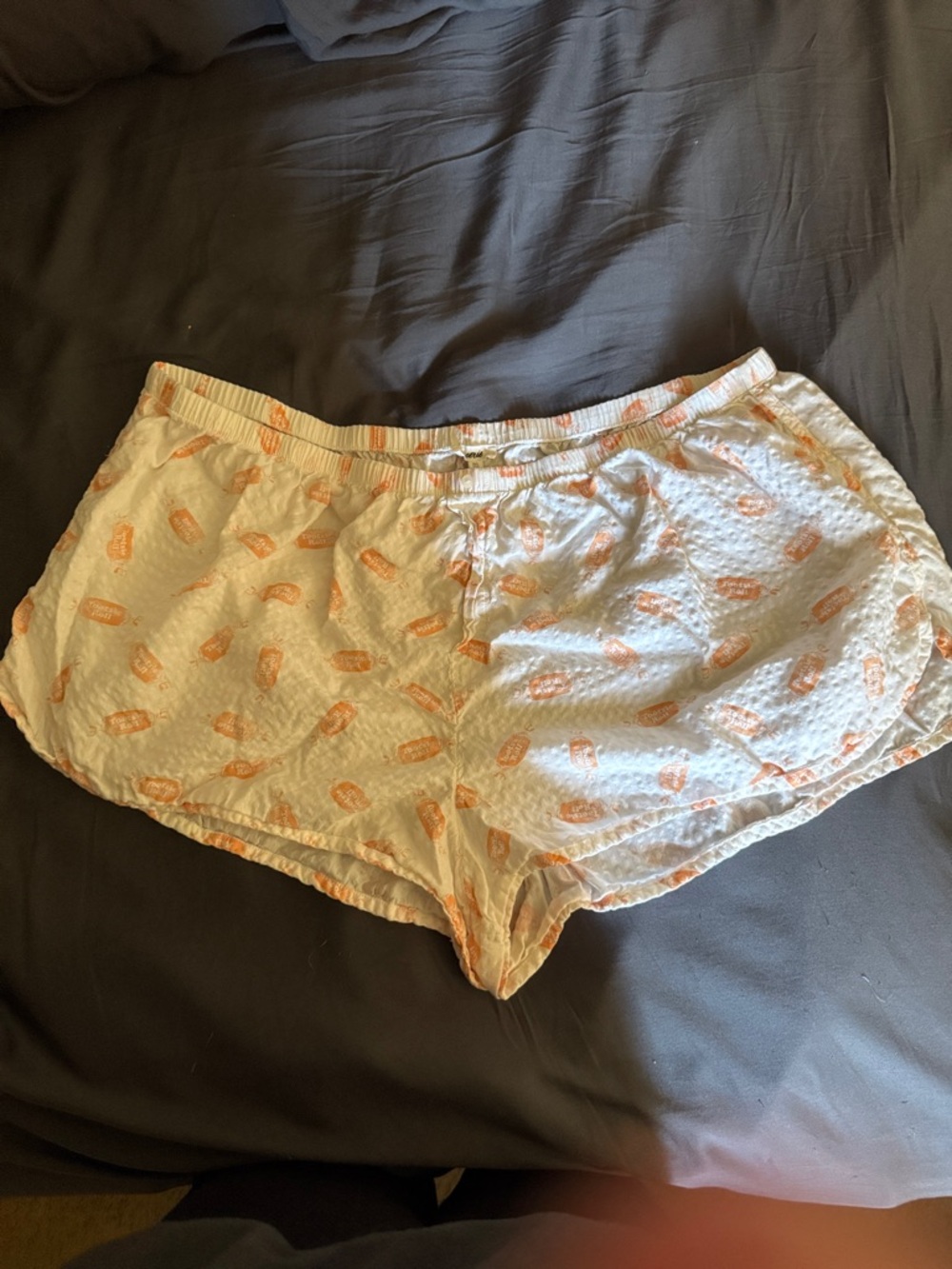 Aerie brand Light Cream seersucker Sleep Shorts with Orange Tootsie Roll print